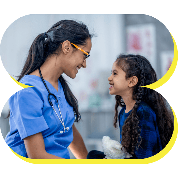 A physician comforting a young patient